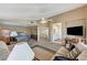 Comfortable living room with cozy furniture, entertainment center, and direct access to the bedroom at 8229 Sedona Sunrise Dr, Las Vegas, NV 89128