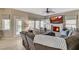 Cozy living room with fireplace, natural light, comfortable seating and door to the backyard at 8229 Sedona Sunrise Dr, Las Vegas, NV 89128