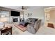 Comfortable living room featuring a fireplace and a large TV at 8229 Sedona Sunrise Dr, Las Vegas, NV 89128