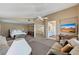 Spacious main bedroom featuring a sitting area, neutral colors, and an en-suite bathroom at 8229 Sedona Sunrise Dr, Las Vegas, NV 89128