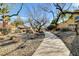 Picturesque walkway through the neighborhood showcasing lush landscaping and well-maintained grounds at 8229 Sedona Sunrise Dr, Las Vegas, NV 89128