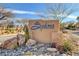 Sedona community entrance sign with desert landscaping and decorative rocks at 8229 Sedona Sunrise Dr, Las Vegas, NV 89128