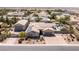 Single-story home with a pool and detached garage in a desert community at 8713 Long Winter Ct, Las Vegas, NV 89131
