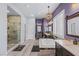 A luxurious bathroom featuring a soaking tub, dual vanities, and a separate glass shower at 8713 Long Winter Ct, Las Vegas, NV 89131