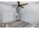 Bedroom featuring a ceiling fan and sliding closet door with an interior door open at 8713 Long Winter Ct, Las Vegas, NV 89131