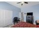 Bedroom with a cozy bed, ornate furniture, closet and a mounted television at 8713 Long Winter Ct, Las Vegas, NV 89131