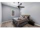 Bedroom with a ceiling fan and a neutral color scheme with wood-look floors at 8713 Long Winter Ct, Las Vegas, NV 89131