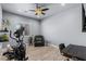 A versatile bonus room with a ceiling fan, exercise equipment, and a small work area at 8713 Long Winter Ct, Las Vegas, NV 89131