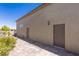 Tan exterior with brick paver walkway leading to a door and desert landscaping at 8713 Long Winter Ct, Las Vegas, NV 89131
