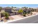 Stunning single-story home with a private gate, solar panels, and lush landscaping at 8713 Long Winter Ct, Las Vegas, NV 89131