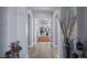 Hallway with elegant lighting and an open view to the living spaces at 8713 Long Winter Ct, Las Vegas, NV 89131