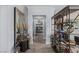 Beautiful hallway with wood floors, open shelving, gray walls, and tasteful decorations at 8713 Long Winter Ct, Las Vegas, NV 89131