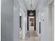 Hallway with recessed lights and decorative chandeliers highlighting the architectural details at 8713 Long Winter Ct, Las Vegas, NV 89131