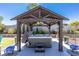 Close-up of a hot tub nestled beneath a pergola at 8713 Long Winter Ct, Las Vegas, NV 89131
