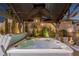 Luxurious jacuzzi under a covered gazebo with ambient lighting, perfect for relaxation and entertaining at 8713 Long Winter Ct, Las Vegas, NV 89131