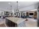 Beautiful kitchen with a large island, dining area, and open layout to the living room at 8713 Long Winter Ct, Las Vegas, NV 89131