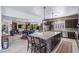 Bright kitchen with center island, dining area, and open access to the living room at 8713 Long Winter Ct, Las Vegas, NV 89131