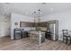 Contemporary kitchen featuring a brick island, stainless steel appliances, and modern fixtures at 8713 Long Winter Ct, Las Vegas, NV 89131