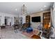 Open-concept living room with shelving, stylish decor, and views into other rooms at 8713 Long Winter Ct, Las Vegas, NV 89131