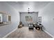 Spacious living room featuring wood-look tile floors and light-gray walls at 8713 Long Winter Ct, Las Vegas, NV 89131