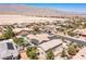 Aerial view of a desert neighborhood highlighting the rooftops, community planning, and mountain backdrop at 8713 Long Winter Ct, Las Vegas, NV 89131