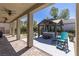 Covered patio overlooking a backyard featuring a hot tub and seating area at 8713 Long Winter Ct, Las Vegas, NV 89131