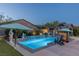 Backyard pool with waterfalls and a covered lounge area at 8713 Long Winter Ct, Las Vegas, NV 89131