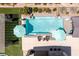 Aerial view of a stunning pool with lounge chairs, umbrellas, and a modern design at 8713 Long Winter Ct, Las Vegas, NV 89131