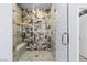 A beautifully tiled walk-in shower with a built-in bench and glass enclosure at 8713 Long Winter Ct, Las Vegas, NV 89131