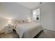Bright bedroom featuring soft carpet, neutral tones, and a comfortable king-sized bed at 912 Allister Fields Ln, Las Vegas, NV 89138