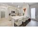 Open kitchen with island seating, modern cabinets, and stainless steel appliances at 912 Allister Fields Ln, Las Vegas, NV 89138