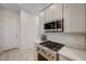 Modern kitchen featuring stainless steel appliances and bright countertops at 912 Allister Fields Ln, Las Vegas, NV 89138