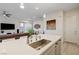 Spacious kitchen with island seating open to the living area and dining space at 912 Allister Fields Ln, Las Vegas, NV 89138