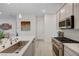 Bright and modern kitchen design with stainless steel appliances and island seating at 912 Allister Fields Ln, Las Vegas, NV 89138