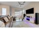 Modern living room featuring stylish furniture, lighting, and plenty of natural light at 912 Allister Fields Ln, Las Vegas, NV 89138