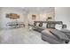 Modern living room with dining area featuring stylish furniture and an open concept layout at 912 Allister Fields Ln, Las Vegas, NV 89138