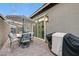 Enclosed back patio area with a grill, patio set, and privacy from neighbors at 912 Allister Fields Ln, Las Vegas, NV 89138