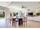 Bright dining room features tile flooring, a modern table, and views of the backyard, great for entertaining at 9628 Matanzas Creek Ct, Las Vegas, NV 89139