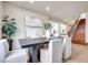Elegant dining area features a modern table and chairs, complemented by stylish decor and natural light at 9628 Matanzas Creek Ct, Las Vegas, NV 89139