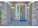 Inviting front entrance with stone pillars and an open doorway creates a welcoming first impression at 9628 Matanzas Creek Ct, Las Vegas, NV 89139
