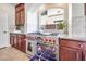 Kitchen boasts a professional-grade range, custom cabinetry, and stylish backsplash at 9628 Matanzas Creek Ct, Las Vegas, NV 89139