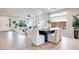 Open-concept living and dining area with modern furnishings, tile floors, and abundant natural light at 9628 Matanzas Creek Ct, Las Vegas, NV 89139