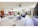 Bright, open living space with large windows, recessed lighting, and a seamless flow to the kitchen and dining areas at 9628 Matanzas Creek Ct, Las Vegas, NV 89139