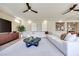 Large living space with tile flooring, recessed lighting, and an open flow to the dining and kitchen areas at 9628 Matanzas Creek Ct, Las Vegas, NV 89139