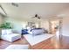 Spacious main bedroom with hardwood floors and a cozy sitting area bathed in natural light at 9628 Matanzas Creek Ct, Las Vegas, NV 89139
