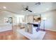 Office area with neutral walls, ceiling fan, and a modern desk with white chairs at 9628 Matanzas Creek Ct, Las Vegas, NV 89139