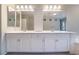 Bathroom with a double sink vanity and ample counter space and storage at 9883 Russian Hill St, Las Vegas, NV 89141