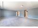 Large bedroom showcasing gray walls, carpeted floor, and recessed lighting at 9883 Russian Hill St, Las Vegas, NV 89141