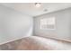 Bright bedroom features neutral walls, plush carpeting, and a window offering natural light at 9883 Russian Hill St, Las Vegas, NV 89141