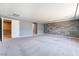Expansive bedroom with gray walls, plush carpeting, and multiple entryways at 9883 Russian Hill St, Las Vegas, NV 89141
